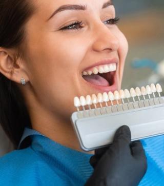 Patient in a dentist chair with a new bright smile