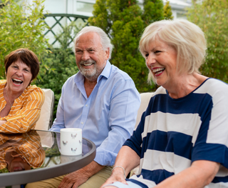 Image of senior patients outside with their beaming smiles