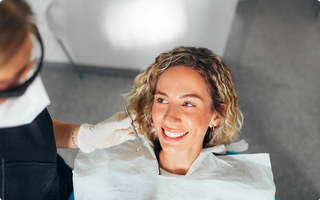 Patient dicsussing dental treatment with a dentist