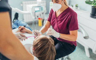 Patient receiving a routine dental scale and clean